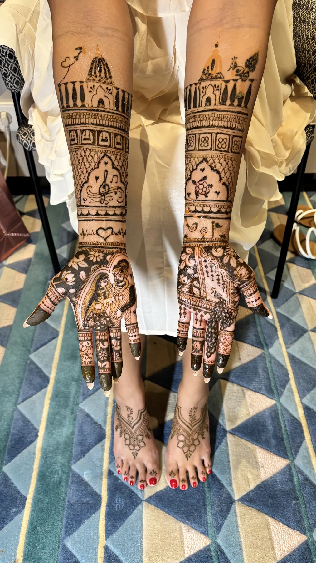 Matching bridal mehndi on hands and feet